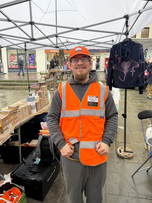 A market steward in a Here to help vest